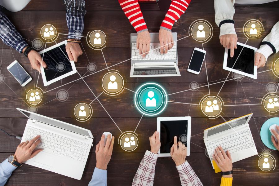 NaNoWriMo and Writing Nonfiction Courses share Laptops and busy people writing